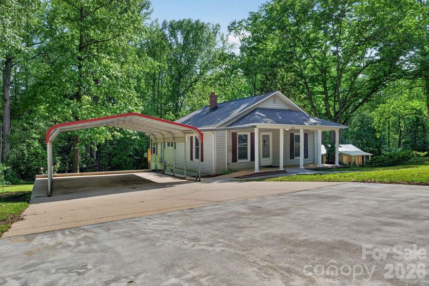Completely renovated and move-in ready! This charming Valdese home has undergone a comprehensive 2026 transformation. Enjoy total peace of mind with a full replacement of electrical wiring, plumbing lines, new windows,  a brand-new heat pump and central forced air. The modern interior features seamless luxury vinyl plank flooring throughout, while the kitchen and bath boast stylish new cabinetry and fixtures. Energy efficiency was a priority, with new insulation installed in both the attic and the walk-out basement. Outside, relax on the covered front porch or utilize the double attached carport and spacious wooded lot. The full unfinished walk-out basement offers massive potential for a workshop or storage. A truly turn-key opportunity!