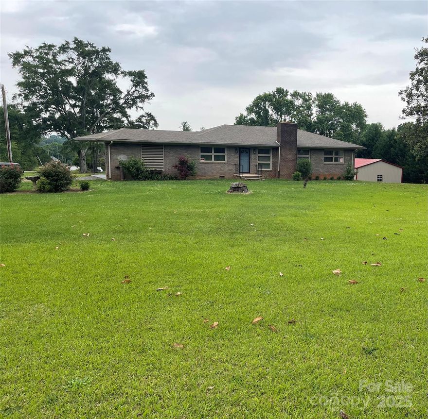 Well maintained brick ranch located on a large corner lot. Close to town but not in the city limits. Family room with wood burning fireplace. All appliances stay. Three bedrooms and two bathrooms. The carport entry goes into the large laundry/sewing room. Would make a great mudroom. Lots of light in the kitchen/dining area. Large deck for entertaining. Large building 30 x24 for your own business or extra car. Basement offers many options. The heat pump is 2024 and the roof is 2017. Termite bond Goforths and located in the ETJ.