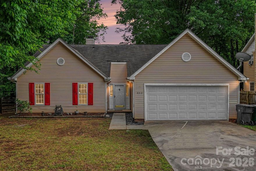 Beautiful ranch-style home with an open floor plan and attached two-car garage. This well-maintained property features vaulted ceilings, a fireplace in the great room, and recent updates throughout, including new countertops and insulation installed in 2026, new cabinets added in 2025, hardwood flooring updated in 2023, and a fenced backyard completed in 2025. The spacious kitchen offers ample cabinet space, island, and dining area. Split-bedroom layout provides added privacy for the primary suite with walk-in closet and dual vanity. Enjoy the large backyard, deck, and front porch, ideal for outdoor enjoyment. Conveniently located near shopping, dining, parks, and major highways. Move-in ready.
