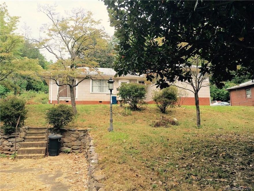 Bring all offers! 2 bedroom 1 bath including room used as an apartment with kitchenette and partial bath with a separate entrance. Partially floored attic space. Kitchen with ceramic tile. Hardwood flooring in most rooms. Laundry closet. 2 outbuildings. Extra lot across the street. Sold as is. Seller is to make no repairs.