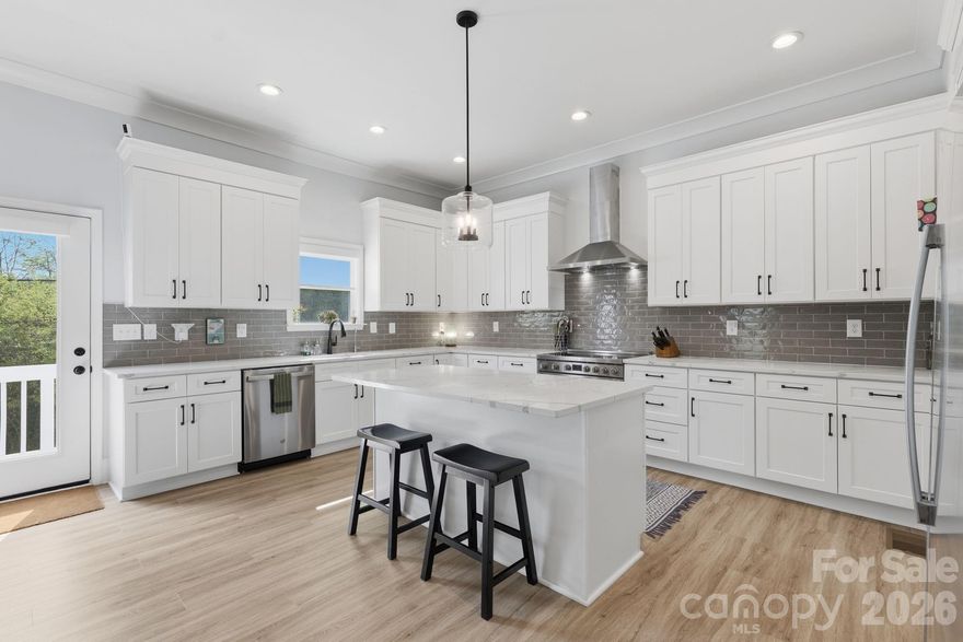 This modern two-story luxury duet townhome in Sedgefield, one of Charlotte’s most sought-after neighborhoods, is just minutes to Uptown Charlotte, South End, the Light Rail blue line, and the lively Rail Trail. This three-year-young custom-level home features an open floor plan, high ceilings, abundant natural light, and wide-plank flooring throughout the thoughtfully designed living space.

The chef’s kitchen offers quartz countertops, an oversized island, stainless steel appliances, custom cabinetry, subway-tile backsplash, and vented hood, opening to a spacious living and dining area with access to the back deck and yard, making your new home perfect for entertaining. 

The expansive primary suite features a large walk-in closet and spa-like bathroom with dual vanities, tons of counter space, freestanding soaking tub, and a HUGE seamless glass-enclosed shower. Three generously sized additional bedrooms provide flexibility for a home office, home gym, guest rooms, or bonus space.

Additional highlights include designer lighting, spacious second-level laundry room, large attached garage w/ EV charger, and ample storage.

Enjoy the rare benefit of a substantial shared lot with NO HOA to worry about —offering flexibility that’s hard to find this close to the city. There's never a dull moment in this community, with plenty of local restaurants, breweries, shopping, and grocery options a few blocks down the street in Southend, as well as easy access to parks and walking trails just minutes from your front door. With quick access to Dilworth, Southpark, Myers Park, NoDa, Charlotte Douglas Airport, and major commuter routes, your new home combines modern design with unbeatable location!

If you’re looking for low-maintenance living with high lifestyle value, this one checks all the boxes.This is a rare opportunity in such a desirable community! Be sure to schedule your tour today!!
