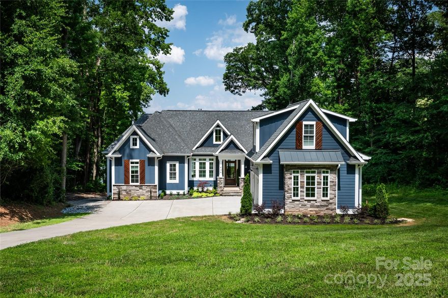 Welcome to your new Lake Wylie waterfront estate! Tucked away in the most private setting on Lake Wylie, this 4,031 SF Belmont home, custom built by Keen Homecrafters, offers 4 ensuite bedrooms, 4-car garage (2 main + tandem lower garage ideal for lake toys or indoor boat storage), and a rare grandfathered boat launch. Enjoy open water views from nearly every room, a private 80' pier with remote-controlled boat lift, jet ski storage, and expansive front and back yards. Pool and cabana plans are in place. Inside, you'll find 2 full kitchens—main with built-in Miele coffee/cappuccino machine—plus a full gym, large bonus/office on the 3rd floor, above the garage, Aqua Kleen, whole-home water filtration system, and premium appliances throughout. Expansive rear decks including both covered & uncovered, plus screened porch w/ wood burning fireplace off the primary suite and pre-wired surround sound complete the luxury package. Minutes from downtown Belmont, yet a world away.