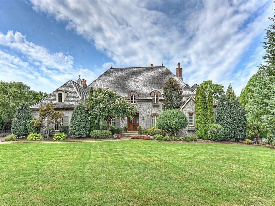 Oklahoma limestone home w/cedar shake roof. Wide open Lake Norman views. Exquisite Craftsmanship throughout. 7 fireplaces. Whole home auto & video, security cameras. 5 BR w/on suite bathrooms. Library w/FP. Chefs kitchen open to hearth room & breakfast. Grilling Porch with FP, owner's favorite! Lake level w/guest suite, rec, billiards, theater, bar, & exercise. Saltwater pool, spa, w/slide, waterfall, gas & wood fire pits, FP, outside shower. Private pier w/lift & 2 jet ski lifts.