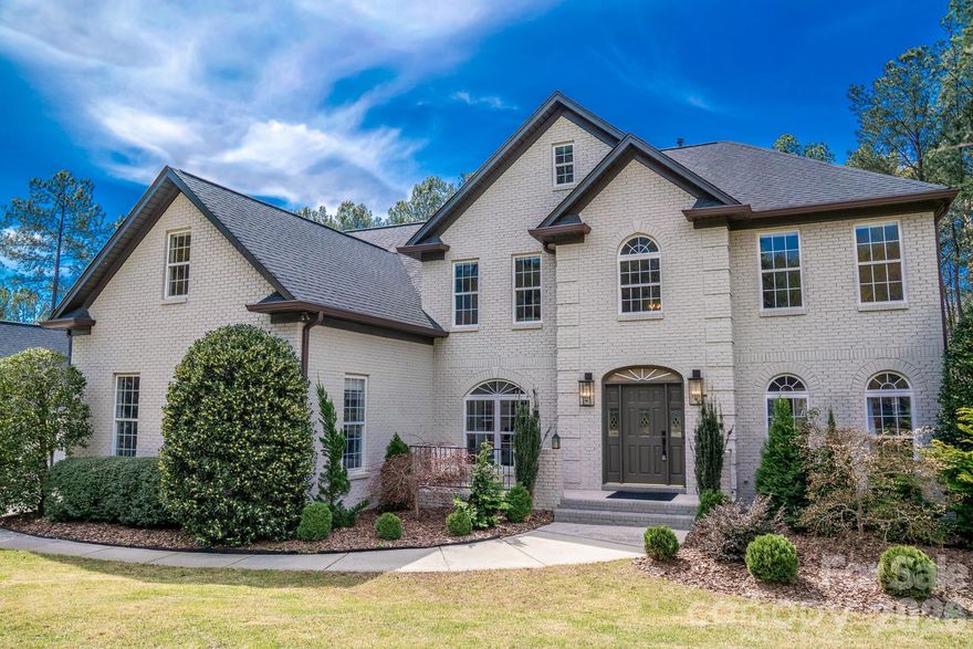 Stop dreaming and start living the ultimate Sailview lifestyle in this stunning 5-bedroom, full-brick estate, which has been meticulously updated and is move in ready; and yes, it comes with its very own DEEDED BOAT SLIP (6-A Slip 58)! From the moment you enter, you’ll notice the sophisticated details that set this home apart, including elegant formal living and dining rooms with tray ceilings, flowing seamlessly into a light-filled family room with a fireplace and a remodeled chef’s kitchen that is truly a showstopper. Upstairs, discover five generous bedrooms, including a primary suite that feels like a five-star spa with a deep-soak jacuzzi tub, walk-in shower, and double vanities. The real magic happens outside, where the backyard transforms into a private resort; spend your summers lounging by the stunning pool, relaxing on the lavish back porch, or hosting cookouts at the professional-grade outdoor kitchen, all set against lush, mature landscaping for total privacy. The three-car garage is a dream for lake lovers, offering ample space for gear and that essential golf cart to zip down to the community docks and your private slip. Living in Sailview means enjoying premier amenities, including the community pool, clubhouse, tennis/pickleball courts, community playgrounds and immediate Lake Norman access, making this more than a home; it's your gateway to lakeside luxury.