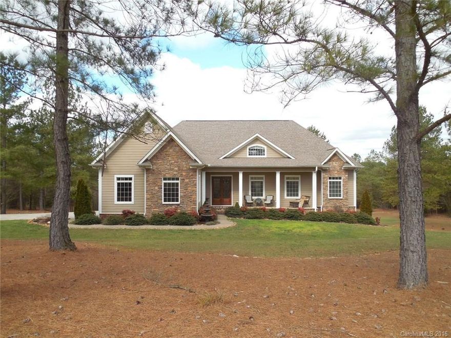 Fabulous custom home located in a wooded LAKE ACCESS  neighborhood is in immaculate condition with quality features throughout.  Main level has great room, chef's kitchen, large eating bar, beautiful cabinetry, granite counters, wood floors.  Master on main as well as 2 other BR. All upscale baths with granite, tile, etc. Lower level  has great room, kitchen, dining, bonus, BR & BA, study & could be separate living quarters or space for friends, family to enjoy. Deck &  patio to enjoy 6+ acres.