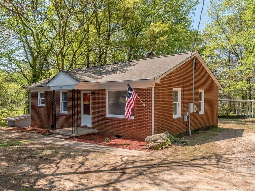 Tastefully renovated full brick ranch on 3/4 acre private wooded lot! A must see! The kitchen has stylish granite countertops, tile floor & new stainless steel appliances, including the 'fridge! Refinished hardwood floors in the bedrooms & living room now gleam! Refurbished bathroom is sparkling with new tile floor, granite vanity top, new mirror, lighting etc. New ceiling fans, interior doors & lighting. Garage/outbuilding has tons of potential - Man cave? Shop? Storage? Partially fenced yard.