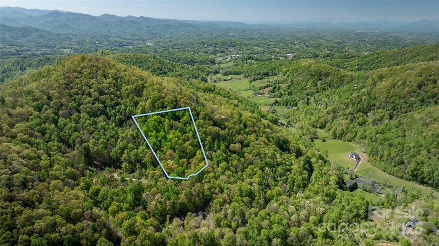Looking for the perfect place to build your mountain getaway? This 7-acre wooded lot in the gated Mountain Park community of Mars Hill offers a rare combination of privacy, convenience, and easy build potential. Tucked among mature trees, the property provides a peaceful setting with great access for development—whether you’re planning a full-time residence or a weekend escape.

Mountain Park is a gated community that features paved roads, a clubhouse, and tennis courts, all while maintaining a quiet, natural atmosphere. It’s just a short drive to downtown Mars Hill and less than 30 minutes to Asheville, giving you access to shopping, dining, and endless outdoor activities. If you’re ready to bring your vision to life in the Blue Ridge Mountains, this is a property you won’t want to miss.