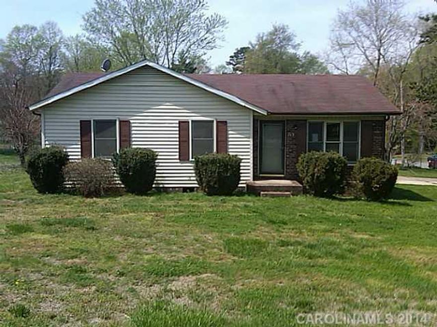 Charming Ranch Home w/ porch, deck, outbuilding & fenced dog yard located at the Oakland Heights in Statesville, NC. Living room at the entry connects to a Kitchen/Brakfast w/ a laundry closet. All 3 rooms are about equal size where master w/ a private bath & 2nd Bath shared. Charming backyard view from a large deck overlooking a grassy partially fenced backyard.