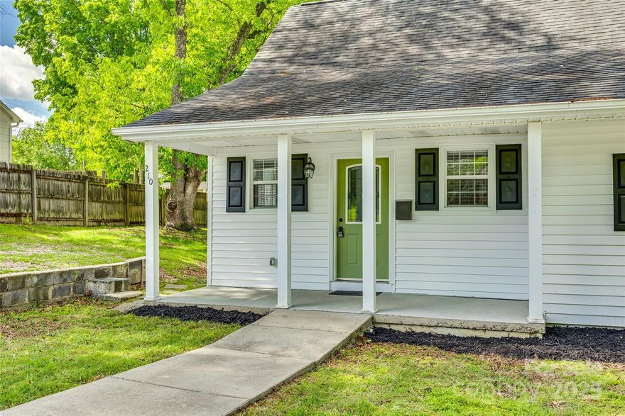 Your cottage awaits. Rocking chair front porch. Large rooms and great flow. The kitchen has all the upgrades, including granite countertops and stainless steel appliances. The refrigerator, washer, and dryer are included. Relax on the back deck and enjoy the shade trees in the yard.  Walking distance to downtown Clover and restaurants and shops! Primary bedroom has an ensuite bath with granite counter tops and tub shower combo. Well maintained and ready for you to move in!! Tankless water heater. Shed. 
The two large bedrooms upstairs have 6'6"  ceilings and can not be counted in 1024 square feet. Award winning Clover Schools.
