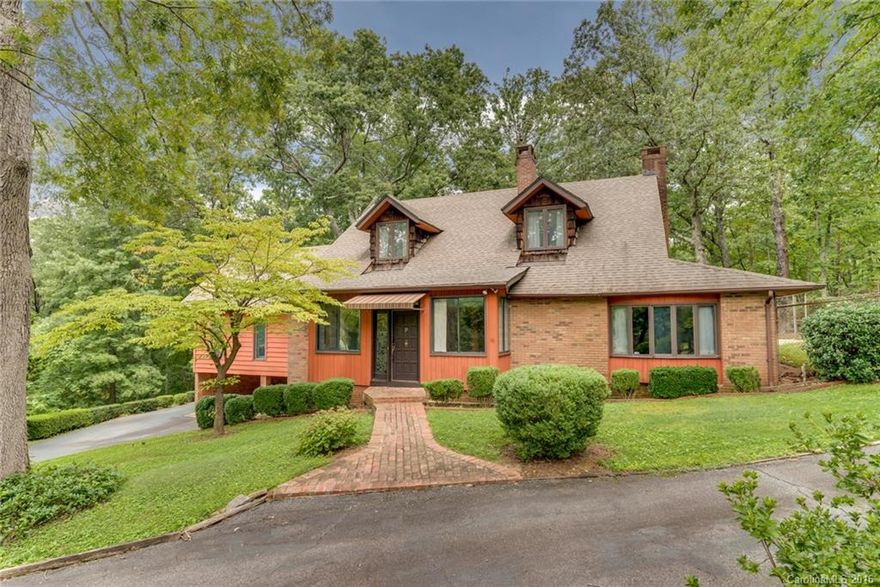 Lovely vintage home situated on 5 acres in the Old Tryon Hunt country. All brick 3BD/2.5BA features a sunroom entry/foyer,  living room w/ stone fireplace and dining room with built-in cabinetry. Spacious Great room with cathedral ceiling, built-in wet bar & window seat to enjoy the mountain views. Large master with see-thru fireplace with adjoining den/library. Great potential for mini-farm with FETA trail access.