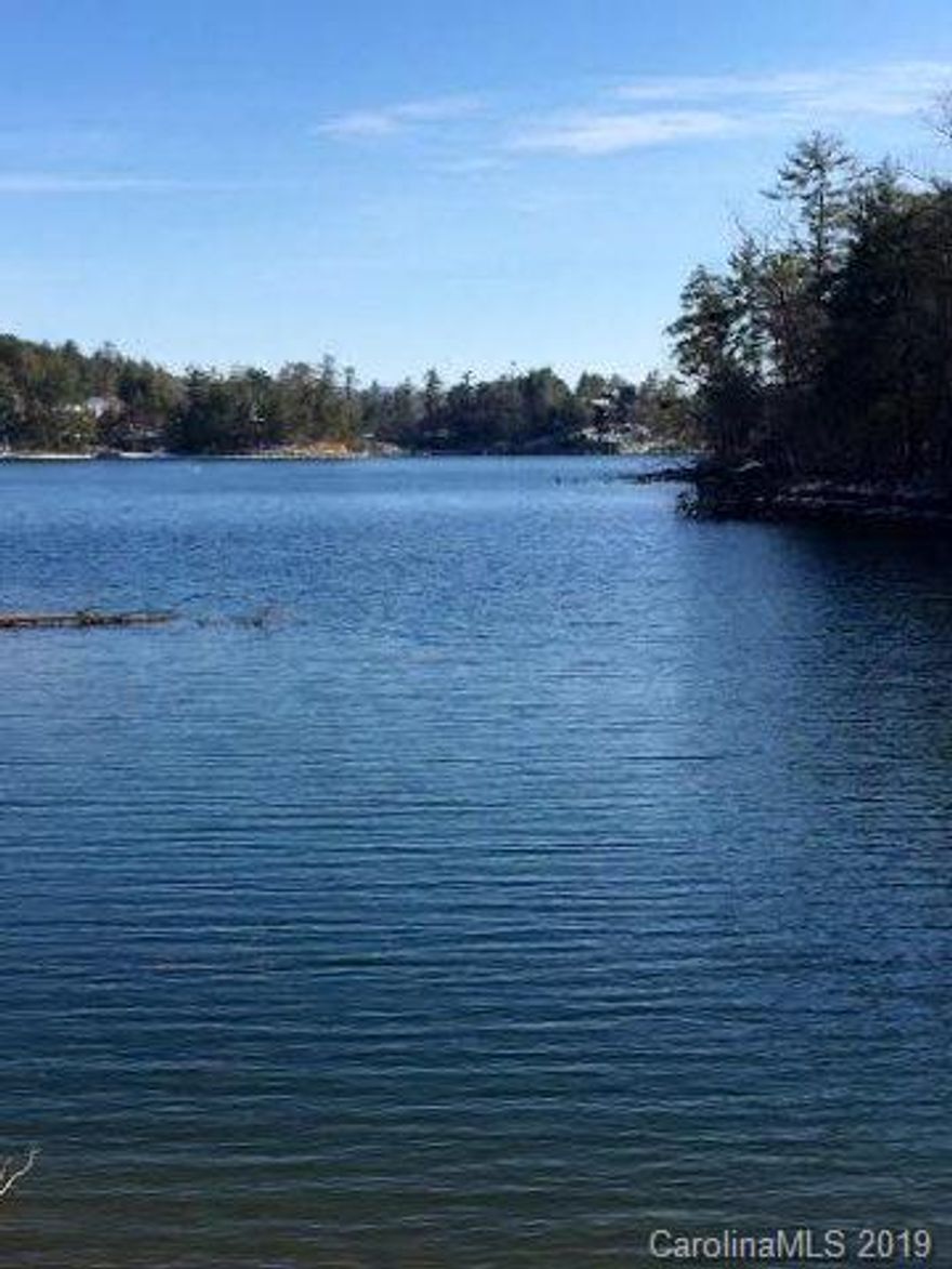 Huge, private, gentle to the water, and a beautiful long-water view.  Those are the characteristics that are only found in the best of the best.  This property qualifies.  You may also ad that it is part of a highly desirable and successful community.  Neighborhood amenities include a pool and clubhouse.  Want more?  It is close to Morganton, the Linville Gorge, Pisgah National Forest, miles of private and public trails, Lake James State Park, mountain biking, and all the other aspects that make Lake James and the surrounding area great.  Shoreline stabilization is already in place.