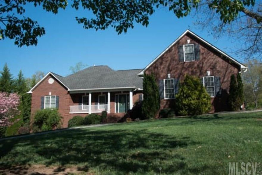 Beautiful 3 bedroom, 2.5 bath brick ranch features a 3-car garage, wood floors, granite countertops in kitchen, laundry with half bath, split bedroom plan and bonus room with a sink. Custom cherry cabinets throughout, Jenn Air stove, Rinnai tankless water heater. Master suite features double sink vanity, jetted tub, separate shower and his and her walk-in closets. Sunroom overlooks great backyard with tiered patio. Security System. Private community access to Lake Hickory at the "Sandbar" with a picnic area, wood BBQ and a horseshoe pit.