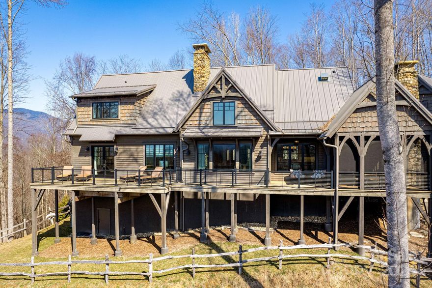 Nestled just 5 mins from the main gate, this home offers a blend of beauty & comfort. Enjoy stunning eastern & western views. The spacious interior features high ceilings & an open floor plan connecting indoor & outdoor spaces, perfect for entertaining or relaxing. With 3 beds & 3.5 baths, incl. a luxurious master suite, there's plenty of space. The kitchen boasts stainless steel appliances & high ceilings with raw wood beams, adding rustic elegance. A basement provides extra storage or living space. Don't miss this mountain retreat that feels like a cabin getaway yet offers upscale living. Balsam Mountain Preserve is a private 4,400 acre club community with 3,200 acres of conservation land and completed amenities including an Arnold Palmer golf course, The Summit House and Mine Tavern restaurants, wellness and equestrian centers and over 40 miles of hiking trails.