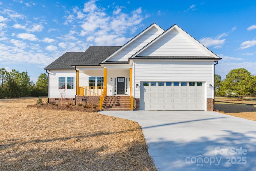 This new construction one-level home is situated on an acre lot and has so much to offer! This open floor plan features a family room, kitchen with white cabinets/island, stainless appliances and granite. Enjoy the spacious back yard and deck that provide you a great space to entertain. The double garage is an added bonus to this new home! Located on a corner lot, this home is just steps away York Prep Academy!