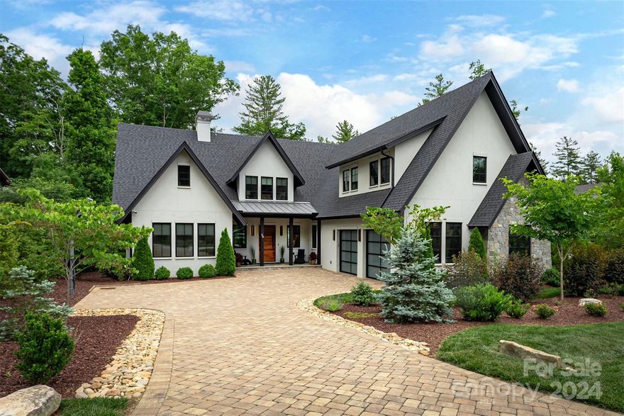 Welcome to your modern retreat, in one of Asheville's most sought-after gated communities, The Ramble at Biltmore Forest. Step inside and be greeted by clean lines, open spaces, and luxurious touches throughout. Gourmet kitchen is equipped with Wolf and Sub Zero. Custom cabinets and beautiful countertops throughout. White oak floors to walnut interior doors, air and water filtration, towel warmers, and infrared sauna, offer a true spa-like experience. Main level boasts 3 light-filled bedrooms, office space, laundry room, and oversized two-car garage. Upstairs, a beautiful suite awaits, perfect for guests or extended family. Accordion glass door allows for indoor/outdoor entertainment. Tranquil backyard with hot tub. Unbeatable proximity to the Living Well Center ensures easy access to additional amenities! Option to purchase fully furnished.