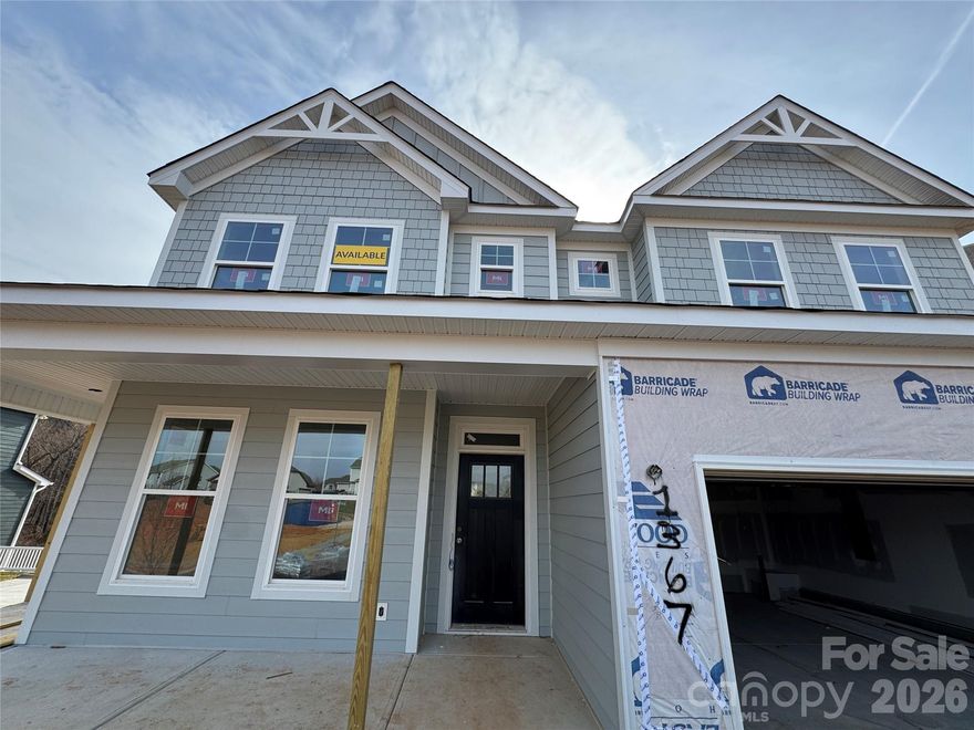 This 2-story Davidson plan with a walk-out BASEMENT has more than 4,000 square feet of living space! The main floor includes a guest suite, a dining room with tray ceiling, and a gas fireplace with shiplap feature wall in the family room. The expanded, designer kitchen has upgraded cabinets & quartz counters, tile backsplash, a stainless range hood, a wall oven & microwave, and a butler pantry that leads to the formal dining room. The upper floor includes a loft, the primary suite with a sitting room, and two secondary bedrooms connected with a Jack-n-Jill bath. The primary bath has a luxury shower with bench seat, two separate vanities, and a linen cabinet. The guest bath on the main has a 4-foot shower with bench seat. The basement features a large rec room along with a bedroom, full bath, and more than 300 square feet of unfinished storage. The rear of the home has a screened-in deck with access through the breakfast area and a patio outside of the basement rec room. Other wonderful additions are a foyer with tray ceiling, a drop zone in the mud room, and quartz counters in all baths. Neighborhood amenities include a pool, dog park, clubhouse & fitness center and future direct access to the paved Catawba Creek Greenway!