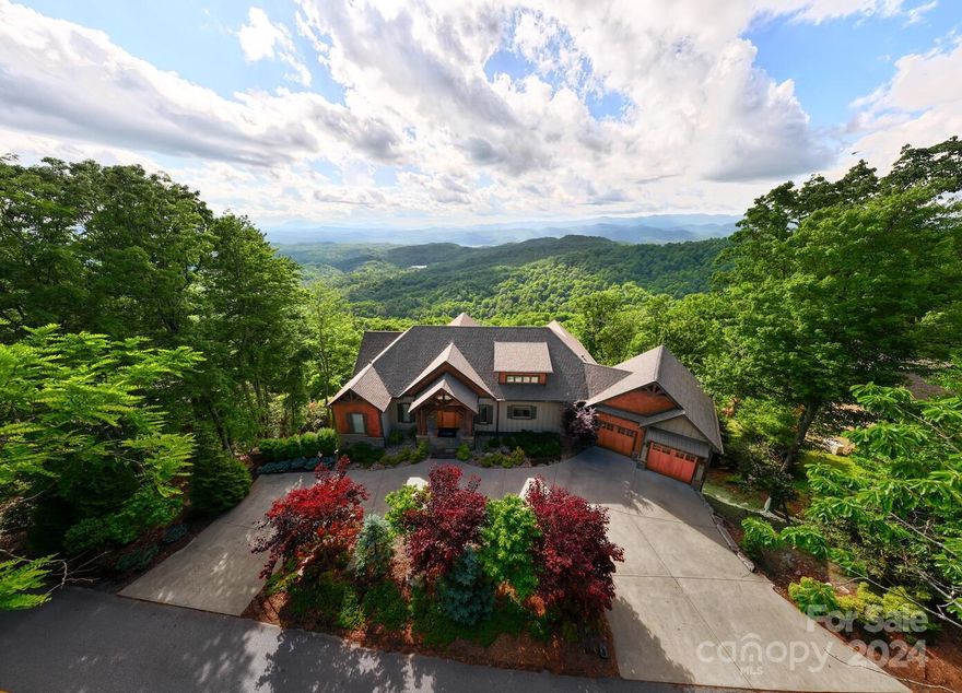 Welcome to 2434 Connestee Trail! This stunning custom home offers a perfect blend of luxury & tranquility in the beautiful mountains of WNC. Features include a spacious open floor plan, chef's kitchen with custom cabinets, luxurious primary suite and office on the main level. 3 additional bedrooms in basement, an exercise room, family room and an office/sewing/bunk room. The exterior boasts a two large decks overlooking the lush forest and West facing panoramic long range mountain views. Connestee Falls has amenities for any outdoor enthusiast, which include a Clubhouse, golf, pool, tennis, pickleball, dog park, hiking trails and 4 mountain lakes. The clubhouse features 2 restaurants, a bar, a Pro shop for the 18-hole Championship golf course and driving range. Just minutes from downtown Brevard. The property was not damaged by the the storm.