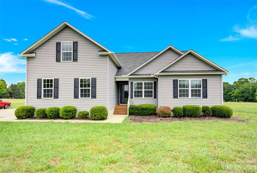Nestled on 1.36 acres, this modern 2013-built home offers a serene escape just a 40-minute drive from downtown Charlotte but with the benefit of lower SC taxes. The open-concept 3bd/2ba home includes a living room with vaulted ceilings, a kitchen with stainless steel appliances and granite countertops, and a bonus room above the garage offering endless possibilities for a playroom, home office, or 4th bedroom. Hardwood floors flow throughout the main living areas, adding a touch of sophistication and elegance. On the covered back porch you can savor the peace and privacy of your expansive backyard - perfect for outdoor gatherings or simply unwinding after a long day. Without restrictive HOA rules, you can enjoy the freedom to personalize your property to your heart's content. Escape the city life and immerse yourself in the tranquility of this nature lover's paradise. Don't miss the opportunity to own this remarkable home, where modern living meets the serenity of the great outdoors.