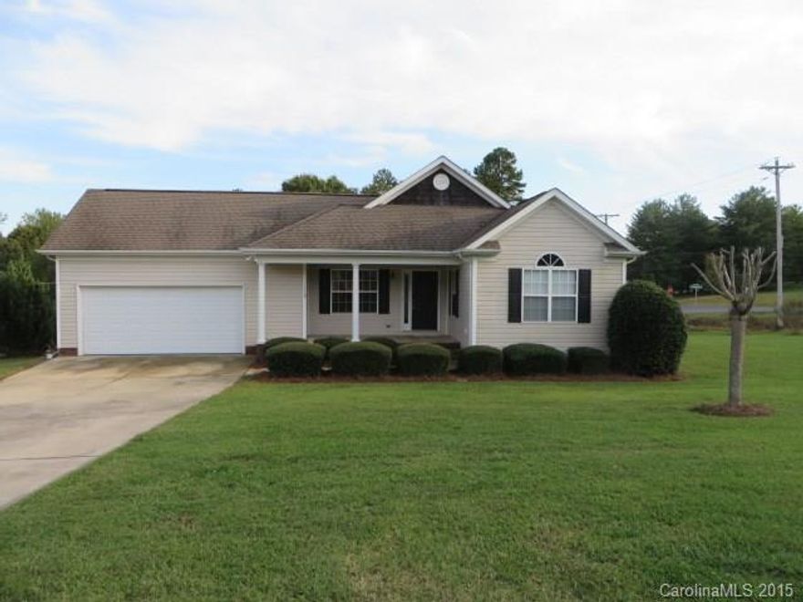 So much curb appeal! The front porch welcomes you to this awesome neighborhood with only 5 homes. Country setting yet convenient to town. Open floor plan with vaulted ceilings, wood floors and split bedroom plan. Spacious master with walk in closet, bath has dual vanities and large tub/shower combo. Large corner lot with lots of room for play, entertaining and a garden. Spacious two car garage. Deck is off of kitchen dining area; perfect for grilling. List agent is related to seller.