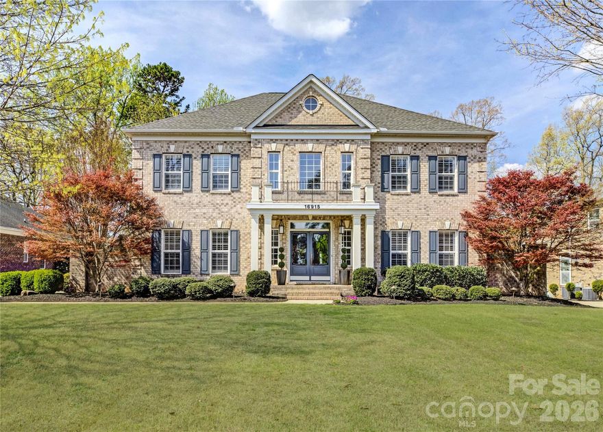 Perfectly positioned along the second tee of the Jack Nicklaus-designed Palisades Country Club, this exceptional all-brick estate welcomes you with a bright, airy two-story foyer and an elegant curved staircase. Rich hardwood floors and nine-foot ceilings flow throughout the main level, where a private office with French doors sits just off the entry, and a formal dining room with crown and chair rail molding provides an ideal space for entertaining
The spacious gourmet kitchen is equipped with a gas cooktop, double wall ovens, and granite countertops, opening seamlessly to the breakfast area and great room. Here, a gas fireplace and illuminated built-ins create a warm focal point, while a graceful curved wall of windows fills the home with natural light and frames picturesque views.
Outdoor living is elevated by an incredible vaulted screened porch with pull-down shades, a custom paver terrace with a built-in firepit, and an additional patio offering prime views of the golf course. A fenced yard enhances both privacy and the surrounding scenery.
Upstairs, the primary suite is a true retreat featuring hardwood floors, a tray ceiling, and a spa-like bath with dual vanities, a glass-enclosed tiled shower, and a corner garden tub. Both walk-in closets are outfitted with custom closet systems. The additional bedrooms are equally well-appointed: bedrooms two and three share a Jack-and-Jill bath, while bedroom four includes a private bath and a large walk-in closet. A generous bonus room provides flexible living space, and the laundry room includes built-in storage for everyday convenience.
Residents enjoy access to The Palisades community amenities, including a clubhouse, outdoor pool, fitness center, and courts for pickleball, tennis, and basketball. Optional golf and social memberships are also available at the award-winning club.