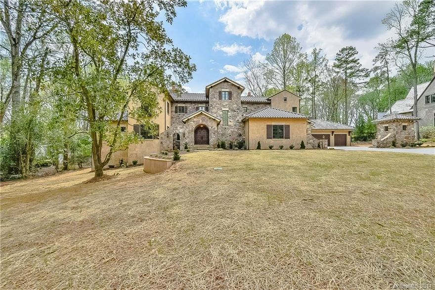 Elegant meets Rustic in beautiful 8000+ sq ft (6254 heated) Italian Tuscan Farmhouse featuring stone/stucco exterior,brown tile roof,reclaimed tile flooring from France,masonry kitchen fireplace,large stone family room masonry fireplace,elegant hardwood flooring,reclaimed wood beams,wine cellar,high end finishes,2.5 acre lot, completed 2/14. Agent related to seller. Pre-qualified buyers only. Seller offering a 20k agent bonus for acceptable offer with closing prior to March 31, 2015!