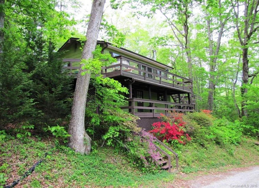 Great mountain retreat for someone looking to be on the road less traveled.  This cottage is a perfect getaway and is nestled on 2.71 private acres. The home features an updated kitchen and great room and 1 bedroom/1 bath on the main level. Lower level highlights a bunk room, ½ bath, & workshop area (not counted in HLA).  Additional features include large deck as well as a 1 car carport