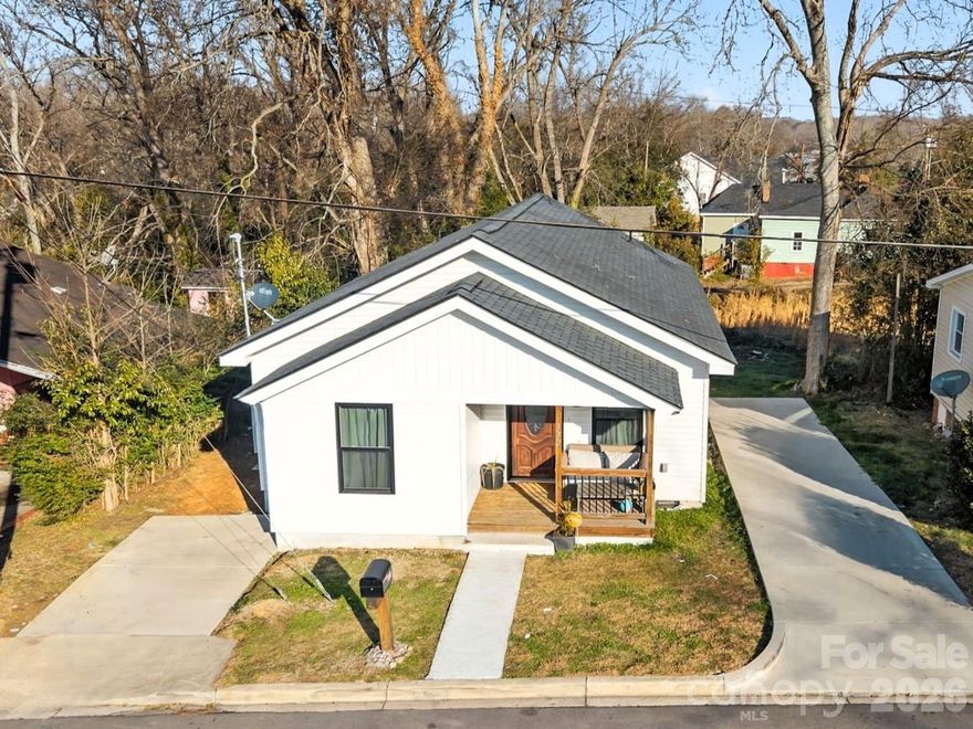 Welcome home to this beautifully remodeled 3-bedroom, 2-bath ranch with NO HOA! Relax on the inviting front porch or entertain guests on the spacious back deck overlooking a flat, usable backyard. Step inside to an open-concept living and dining area that flows seamlessly into a modern kitchen featuring butcher block countertops, new cabinetry, and stainless steel appliances. The desirable split-bedroom floor plan offers added privacy. The primary suite includes an en-suite bath and great natural light with views of the backyard. Secondary bedrooms are generously sized and share a full bath. Enjoy low-maintenance laminate flooring and recessed lighting throughout. Lots of parking space with double driveways. Major updates completed approximately three years ago include: roof, HVAC, water heater, flooring, plumbing, electrical, and fixtures — providing peace of mind for years to come. Located in a growing area surrounded by new construction and beautifully remodeled homes. Conveniently situated in the heart of Lancaster, just minutes from Downtown Lancaster, Charlotte, and Indian Land. Close to Hwy 521, Independence Park Trail access, schools, Wylie Street Pool, and the Lancaster County Library.

Don’t miss this move-in-ready gem in an up-and-coming location!