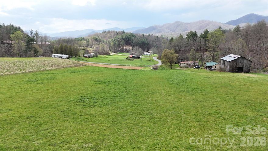 Almost 10 acres of pasture in the Shelton Laurel community of Marshall with flat or rolling terrain, a quality barn and installed four bedroom septic system. This acreage is perfect for homesteading, farming or private estate and offers a beautiful valley view on easy to build acreage. Tilson Branch Road is a state maintained road and property offers easy access. This is a rare find in Madison County, don’t miss the chance to own this one. The few barn contents will not be removed and is to convey with sale of property.