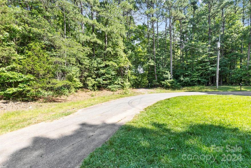 Discover your dream home's perfect setting on this stunning parcel nestled away in Denver, NC, just a short drive to Lake Norman. This 2.41-acre vacant parcel presents an idyllic landscape, featuring a level terrain seamlessly blending into & gently surrounded by Red Oaks, Beech Nut, and Pine Trees. Tucked away on a tranquil cul-de-sac road, this countryside gem offers a peaceful retreat while ensuring convenience with essential amenities, shopping, & dining all within a convenient few minute drive. Seize this one-of-a-kind opportunity today and envision the possibilities awaiting your personalized touch! There is a well & septic in place that has not been used in many years. An inspection was performed in 2023 as those results & documents are available upon request. This parcel is being sold as one, yet has the convenience of keeping it subdivided, or simply build your own family compound! 
NO HOA! Schedule your visit now and step into the beginning of your forever home journey.