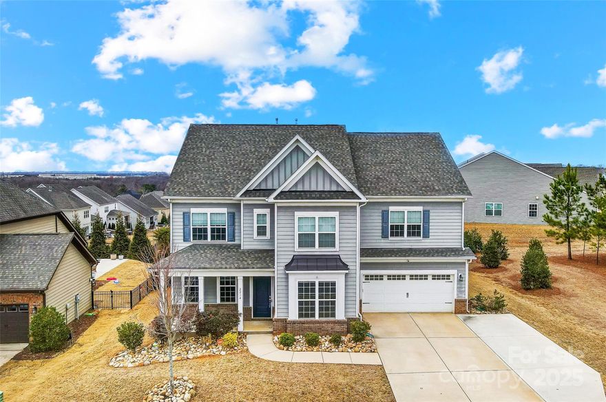 Spacious 5 bedroom 3 1/2 bath home w/heated saltwater pool, waterfall & custom benches! Home is located in the highly desirable Waterside at the Catawba. Low HOA! Award winning Fort Mill Schools. The main floor has secondary owner's suite w/ ensuite bath, office/flex room w/ French doors, dining room w/ custom cabinetry & wine fridge and custom mud room. Living room has a gas fireplace & surrounding built-ins. Gourmet kitchen w/oversized granite island, gas cooktop, ample cabinets & large pantry w/custom shelving.  Sunroom overlooks the pool/yard as does the extended breakfast area. Upstairs has loft, bonus room, laundry room (custom built ins). Spacious primary suite has 2 large walk-in closets, ensuite master w/ garden tub, oversized tile shower, double sink vanity & linen closet. Walk in closets in additional bedrooms. Taxes based on non-primary residence. Stunning sunset views. Lots of neighborhood amenities. Minutes to Charlotte!