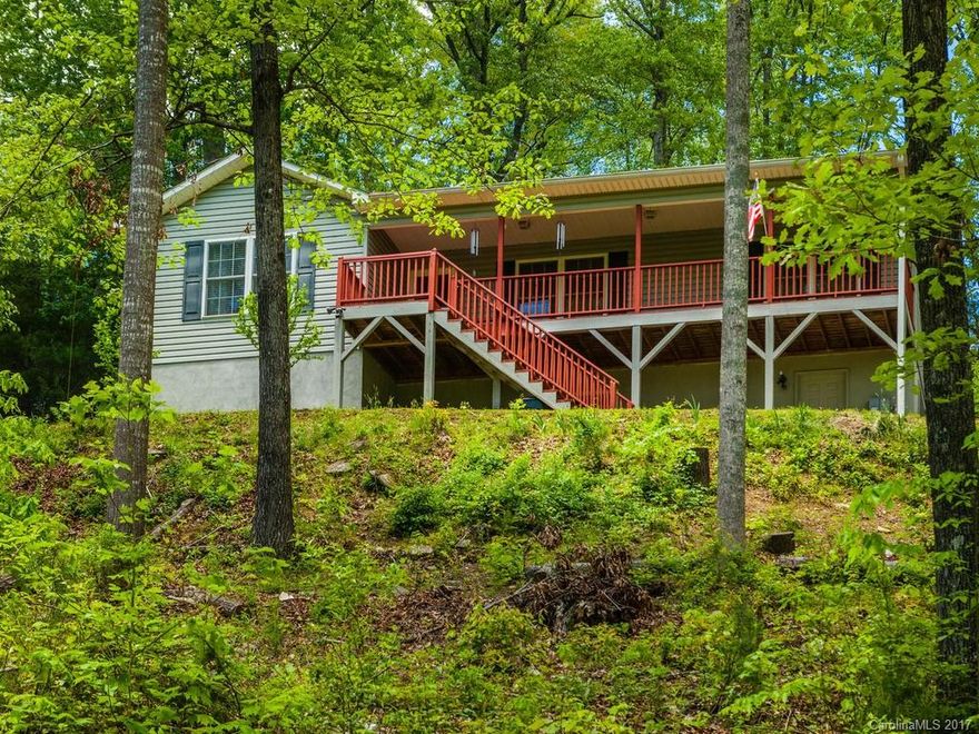 Impressive 3 bedroom 2 bath home on a full basement with a 2 car garage, and a very nice out building. This home captures a serene setting, beautifully rooted in Pisgah Forest.  Witness the elegance of all four seasons in a home tucked away with a subtle mountain backdrop. Shared driveway.