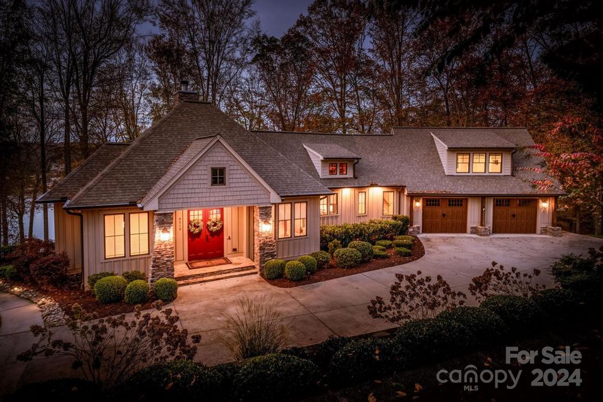 Experience mountain-like serenity with stunning Lake Norman views from this beautiful home on a secluded, manicured acre lot. Enter from the circular driveway and step through the cvd. porch into the soaring great room w/ amazing lake views. Relax by the massive stone fireplace in this bright, open space just off the impressive kitchen w/ huge island. Main level primary bedroom also offers incredible lake views from its own wing of the home. Upstairs find a lg. bedroom suite w/ full bath, also perfect as a media room. Downstairs features a large family room w/ wet bar, wine fridge, kegerator, and two additional bedrooms & baths. Enjoy the outdoors from the deck, screened porch, patio, or lakeside patio w/ fireplace. Take a dip in the calm waters of this area of the lake from the cvd. dock w/ boat lift. Additional features include a huge oversized garage, cart path to lakeside parking pad, backup generator, & built-in Sonos sound. This property is truly impressive and won’t disappoint.