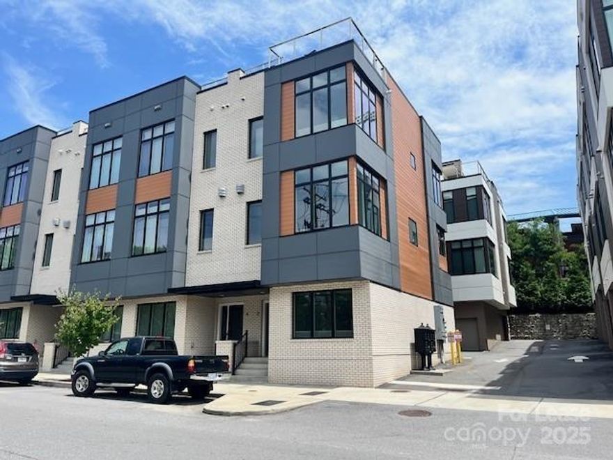 DON'T MISS OUT ON THIS BEAUTIFUL TOWNHOME

3 story, 3 bedroom and 3 1/2 bathroom townhome in downtown Asheville, adjacent to McCormick Field baseball stadium. Newer construction with elevator, modern finishes and downtown views. Gourmet kitchen with stainless Bosch appliances and two pantries. Spacious living area with large windows. Upper level offers master suite, laundry with full size washer and dryer, and second bedroom with full bath. Views of downtown, mountains and fireworks from McCormick field from the private rooftop patio with large enough area for multiple sitting areas. Two car garage for secure off-street parking.
