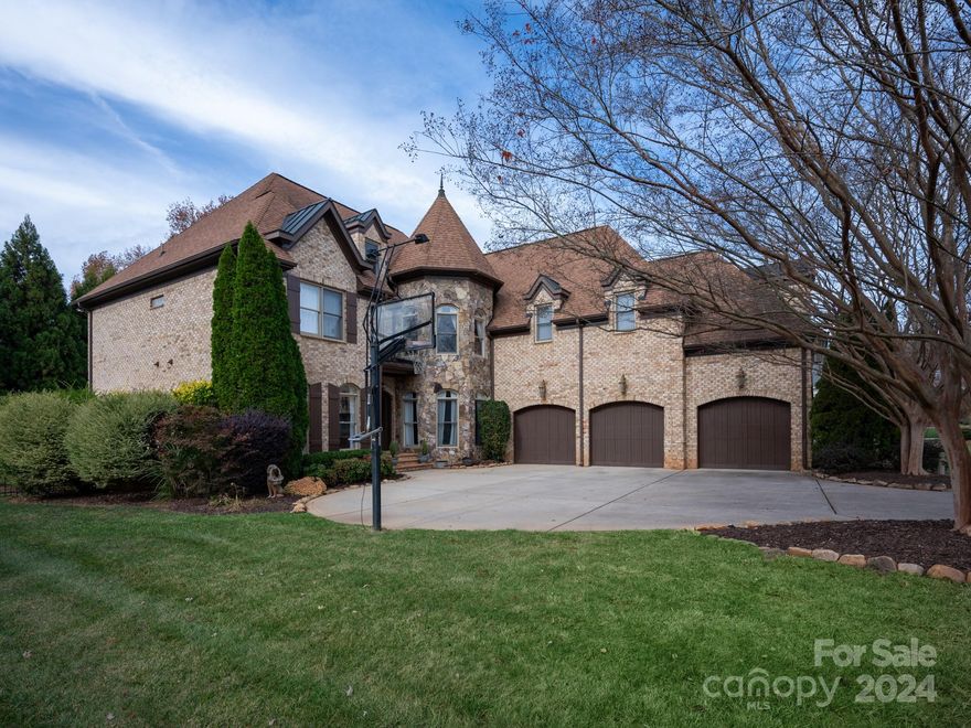 Beautiful 5700sf custom home in popular gated Providence Downs community with amazing covered porch with wood burning fireplace. Light and bright interior with guest suite on main plus a private office. Lovely kitchen with gas range & double ovens overlooks sunny breakfast area and beautiful keeping area with stacked stone fireplace. Upstairs features the master suite retreat, including oversized walk in his and her custom closets, sitting area + a GORGEOUS completely remodeled luxury bath with vessel tub, deluxe spa shower + new cabinets and tops. The third floor offers a versatile bonus room, exercise area, and an additional bedroom with full bath. Outdoors features a lovely private fenced yard and amazing covered porch with fireplace perfect for a peaceful evening and weekend retreat! Zoned for Marvin schools.