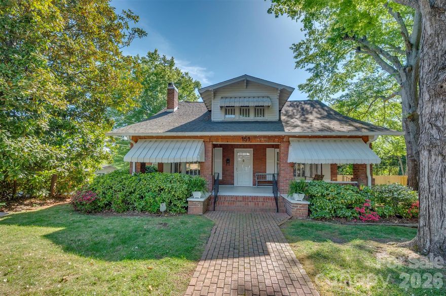 Step into timeless charm with this beautifully maintained brick Craftsman-style bungalow, perfectly blending classic character with inviting comfort. From the moment you arrive, the welcoming front porch, mature trees, and manicured landscaping set the tone for what’s inside. The main living area is filled with natural light and showcases gleaming hardwood floors, a cozy fireplace, and elegant molding that highlight the home’s craftsmanship. The spacious living room flows effortlessly into a charming sitting area—ideal for relaxing or entertaining guests. A den offers a warm and inviting retreat, featuring rich wood paneling, exposed beams, and another fireplace—perfect for cozy evenings or a quiet reading space. The home’s thoughtful layout provides both open gathering areas and intimate spaces. The primary bedroom is conveniently located on the main floor, offering comfort and accessibility, while three additional bedrooms upstairs provide plenty of space for family, guests, or a home office. Throughout the home, you’ll find classic details like built-ins, vintage-inspired lighting, and large windows that bring the outdoors in. The combination of traditional style and functional living makes this home truly special. Outside, enjoy a picturesque setting with a screened porch, mature shade trees, a peaceful yard, and excellent parking options in the rear of the home, complete with a detached garage—perfect for additional storage, hobbies, or workshop space. Conveniently located near downtown Forest City, you’ll enjoy easy access to local shops, restaurants, and community amenities. This is a rare opportunity to own a home full of character, warmth, and timeless appeal—schedule your showing today!