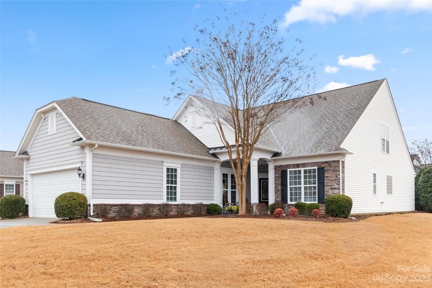 Surrey Crest w/ loft & 3-season room in Sun City! The kitchen boasts w/ granite counters, SS appliances, recessed lighting, a large island, & a dining area! The great room has beautiful hardwood flooring, a gas-log fireplace, & a TV niche. A home office w/ double glass pane doors is great for working from home or to use as a hobby room. The spacious primary suite w/  tray ceiling has windows overlooking the rear yard and has an en-suite bathroom w/ a garden tub, glass enclosed shower, & a dual sink vanity. A guest bedroom & hall bath are great for overnight guests. Loft area offers another bed/bath and additional space for a 2nd living area or game room! Enjoy coffee while relaxing in the 3-season room (w/ pulldown shades, recessed lighting, & a ceiling fan), and host friends & fam on the rear patio w/ privacy trees! This home also features a glass accent front door w/ sidelight, an extended garage, & driveway extensions on both sides. Attic space for extra storage- always a bonus!