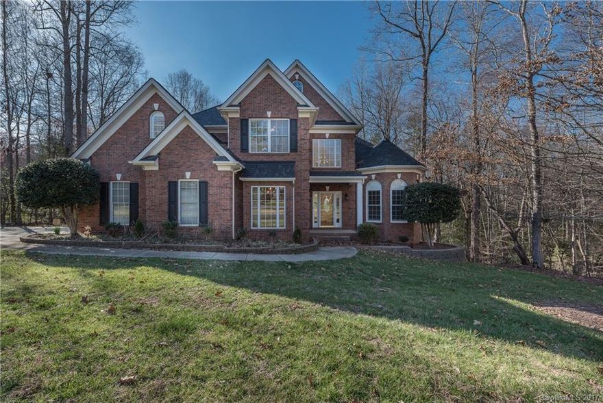 Prepared to be impressed with this 5 bedroom 4.5 bath full brick custom home, nestled on 1.45 acres in desirable Oxford Place. Open and airy this home has it all! 2 story great room with tons of light, refinished hardwoods on 1st floor. Prepare your gourmet meals in this chefs kitchen. Fresh paint with updated colors.  HUGE finished walk out basement ideal for IN-LAW suite, with great room, private bath, exercise room and walk in wine cellar. Award winning Fort Mill Schools.