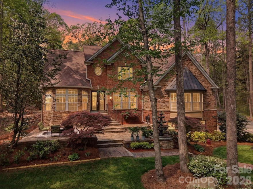 Private, full brick custom home on 1+ acre with detached garage/workshop and room for a pool and zoned for top rated Fort Mill schools, this is the one you have been waiting for! Set back from the street and surrounded by mature trees and established landscaping, this property delivers a true sense of privacy and seclusion. Inside, a two story foyer opens to a spacious dining room with butler’s pantry. The main living area features expansive ceilings and a double sided gas fireplace connecting the great room and kitchen. The updated kitchen (2026) features quartz counters and backsplash, new gas cooktop, updated lighting, and a large island plus a breakfast area and additional sitting/morning room overlooking the backyard. A second oversized living space with built-ins offers flexibility for media, recreation, or gathering. The primary suite on the main level provides convenience and complete with a renovated bath (2024) featuring quartz counters, a large walk-in shower, garden tub, and a spacious walk-in closet.  Upstairs, you’ll find four additional bedrooms, including a guest suite with private bath, plus a flexible room currently used as an office that has closets and could be used as 5th BR/bonus room. One of the most unique features of this property is the detached 1,073 sq ft garage/workshop, complete with 200 amp service, heat pump, built-in cabinetry, and storage ...ideal for a workshop, home business, car enthusiast, or future guest suite/multigenerational living potential. This home has fresh paint and beautiful trim work throughout, they don't make homes like this anymore! There is plenty of room to add a pool and you are zoned for Dobys Bridge Elementary, Forest Creek Middle and Catawba Ridge High School. New Harris Teeter shopping center is minutes away and you are just ten minutes from Publix, Target, Costco, Homegoods and so much more retail and restaurants!