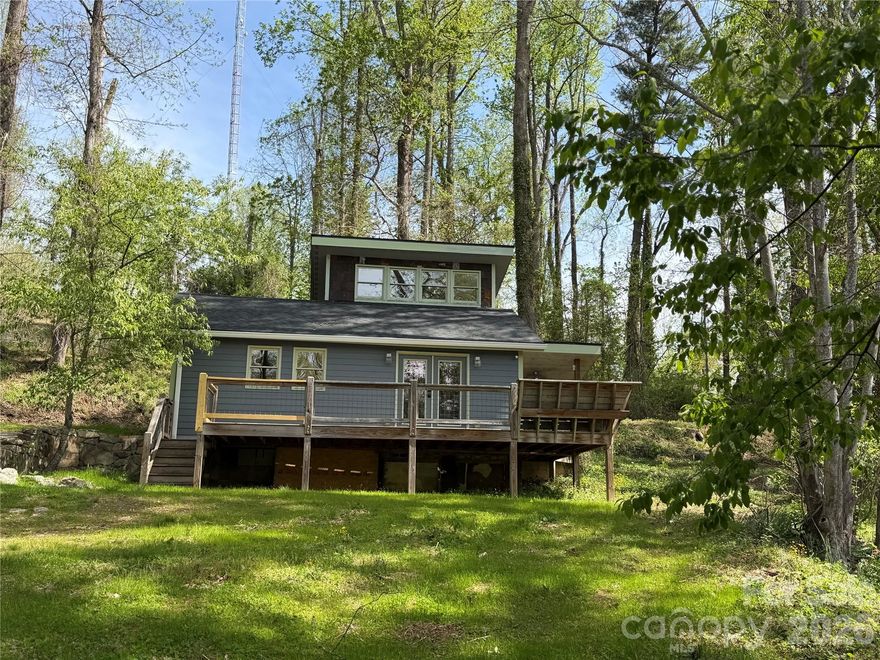 Bright and sunny home located just a couple of miles from Historic Downtown Hendersonville. Enjoy the convenience of a Hendersonville address while paying county-only taxes.
Recently updated throughout with numerous improvements including a new roof, new lighting, new appliances, fresh interior paint, new flooring, updated kitchen counters, sink and fixtures, bedroom ceiling fan, and mini-split heating system. You’ll also appreciate the creative touches such as the kitchen island, abundant tile work, and warm wood accents that add character and style.
The open floor plan connects the kitchen and living area, creating an inviting and functional space for everyday living and entertaining. The kitchen features heated tile flooring, generous pantry storage with good lighting and shelving, and easy access to the covered side porch—perfect for extending your living space outdoors. Be sure to explore the pantry and the additional storage area tucked behind it for even more usable space. The bathroom also includes heated tile floors and a tiled walk-in shower.
Upstairs, a bright and sunny bedroom offers a comfortable retreat. The home makes thoughtful use of additional storage space throughout. The home makes thoughtful use of additional storage space throughout—don’t miss the ample storage in the eaves and behind the upstairs closet.
The property experienced damage during Hurricane Helene; however, nearly everything has been redone, providing a fresh and updated interior.
Outside, enjoy a blend of greenery and mature trees offering natural privacy, along with open yard space ready for your personal touch—whether you envision landscaping, a fire pit gathering area, or garden beds.
Relax on the welcoming front deck with abundant sunshine and seasonal winter views.