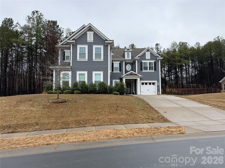 Located on a beautifully maintained property on a full acre in the gated community of Bretagne, this exceptional home combines upscale design with standout amenities. The impressive exterior presence and 3-car garage set the tone, while inside you’ll find refined details including a statement accent wall in the living room and wainscoting in the dining area. The chef’s kitchen features a large island, stainless steel appliances, double ovens, and a gas cooktop, ideal for entertaining. A spacious upstairs loft adds flexible living space, and one bedroom with custom built-in storage is perfect as a craft or hobby room. Baths are elevated with frameless glass shower doors. Enjoy outdoor living with a backyard patio and private basketball court. Bretagne amenities include a gated entrance, outdoor pool, and playground, with a prime location between Indian Land, Fort Mill, and Ballantyne.