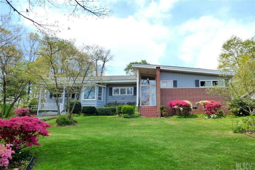 Mid-Century Modern home in convenient NW Hickory location! Offering one-level living, move-in ready condition, and level lot, this three bedroom, 2.5 bath home is ready for its new owner! A vaulted ceiling foyer with stylish period chandelier welcomes you home and into the spacious great room with a wall of windows overlooking the sunroom and beyond into the private backyard. The galley-style kitchen has all appliances and a bayed breakfast area. A den addition features a stone floor, clerestory windows, full bath, laundry, and would make an easy master bedroom conversion. A central hallway offers three bedrooms, a full bath, and convenient half bath. Additional perks include oak hardwood floors and period tile throughout, all new neutral paint, replacement windows, and more! Level backyard with rear patio and storage building. Convenient Forest Hills location with easy access to I-40, Hwy 321 and Hwy 70.