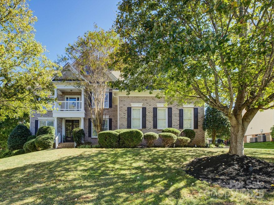 Experience Carolina living at its best in the heart of Bridgemill—one of the area’s most sought-after communities, known for its award-winning schools, vibrant neighborhood activities, and resort-style amenities. Residents enjoy access to a stunning clubhouse, dog park, fitness center, tennis and game courts, playgrounds, pond, outdoor pool, and endless sidewalks that invite evening strolls. This stately 4,200+ sq ft brick executive home spans three impressive levels and offers space, comfort, and sophistication. The main level features a private home office with French doors, a guest suite with full bath, and a two-story great room with a fireplace framed by custom built-ins and floor-to-ceiling windows. The kitchen opens to a sunny breakfast area and a cozy keeping room with its own fireplace. Upstairs, four additional bedrooms include an exceptional primary suite with tray ceilings, a luxurious bath, and an oversized adjacent room ideal for a gym, reading nook, or second office. The third floor provides the perfect recreation or media room. Also enjoy the private, tree-lined backyard, complemented by a 3-car garage, hardwood floors on the main level, and brand-new carpet on the upper level.