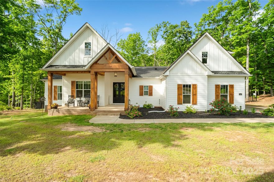 Welcome home to your dream retreat nestled in Clover! This beautifully maintained home, filled with natural light, is permitted for 4 bedrooms but could easily have 6. Over an acre of private, serene land offers the perfect blend of comfort, space, & Southern charm. Step inside to discover an inviting open-concept layout featuring a spacious living area, modern kitchen with quartz countertops, stainless appliances & ample cabinetry; ideal for entertaining or everyday living. The main level primary suite offers a peaceful escape with large walk-in closet & en-suite bath, complete w/ dual vanities & a soaking tub. Enjoy the outdoors from the covered porch or expansive backyard-perfect for gatherings, gardening, or simply unwinding in your private oasis. Plenty of room to add a pool! Award-winning Clover Schools & a short drive to Lake Wylie, shopping & dining; this home offers the ideal mix of rural tranquility & suburban convenience. Don't miss the opportunity to own this gem!