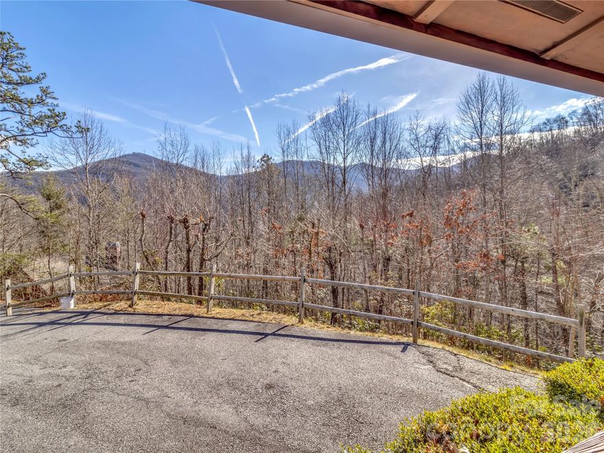 Welcome to 30 Edgewater Lane in beautiful Maggie Valley, a private hilltop 2-bedroom, 2-bath vacation rental offering mountain views and a peaceful Western North Carolina setting. Designed for relaxation, this inviting retreat features a hot tub, fireplace, and outdoor fire pit—perfect for unwinding after a day of exploring the Smokies. Enjoy the privacy of a secluded mountain setting while remaining conveniently close to Maggie Valley attractions, outdoor recreation, dining, and shopping. Ideal as a personal getaway or income-producing short-term rental, this property provides the perfect blend of comfort, privacy, and location. A rare opportunity to own a well-appointed mountain retreat in a sought-after Maggie Valley location.