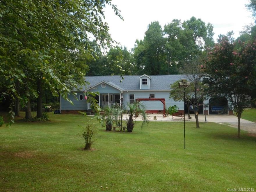 Wonderfully Maintained Custom Built 3 Bed/2Bath Ranch on 1.5 Acre Lot.  This Home has  so Much Character as Well as Plenty of Upgrades.  Large Gourmet Kitchen Perfect for Cook Enthusiast w/it's Granite Counters, Island, SS Appliances & Vegetable Sink. Formal Dining or Sitting Room.  Split Bedroom Plan & Tons of Hardwood Flooring.  Surround Sound in Kitchen, Formal, Master & Great Room.  Covered Front & Back Porches w/Block Ceramic Tile.  Heated & Cooled Rec/Office in Garage. Fenced Back Yard.