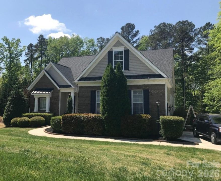 Live in the heart of the ultra charming & popular town of Belmont, NC! From the moment you pull up to this gorgeous 1.5 story home & see the meticulously manicured lawn w/in-ground irrigation & beautiful brick facade w/new architectural shingle & metal standing seam roof - you'll want it to be yours! Inside features include a main level owner's suite with a large walk in closet with built ins off of the master bedroom, AND a guest bedroom w/it's own full bathroom, a half bath, hardwood floors, heavy crown molding, 10 ft. ceilings, 8 ft. doors, stunning quartz counters w/tile backsplash, stainless appliances, & an upstairs bonus room & spare guest suite w/full bath. There's also a walk in pantry & huge main level laundry room w/wash sink. Spend those cool Fall evenings inside sitting in front of the gas log fireplace or Spring mornings sipping coffee on your screened in back porch or maybe afternoons grilling on the freshly painted deck overlooking your private, wooded & fully fenced backyard. Truly a must see!
