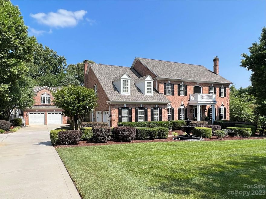 Spectacular Davidson estate walking distance to Main St. This sun-filled brick home truly has it all; 5 bedrooms across 3 levels in the main house, 2 car attached + 2 car detached garage w/studio apartment above offers kitchen & full bath for in law/au pair/studio space. This private 1+ac oasis has mature landscaping, expansive pool & spa area w/gas fire pit just steps from the walk out basement, which features billiards area, entertainment space, wet bar, laundry rm & guest en suite. The main level features formal living & dining rooms, office, family room & gourmet kitchen w/keeping room adjacent to oversized covered patio leading to the backyard & pool area. The 750sf primary suite boasts vaulted ceilings, sitting area, walk-in custom closets & spa-like bath. 3 add’l BRs, 2 bathrooms & 2nd laundry complete the upper level.  4 fireplaces lend warmth & character to the home. Located near entry to the Greenway & just 1 mile from Davidson College, this truly is an extraodinary property