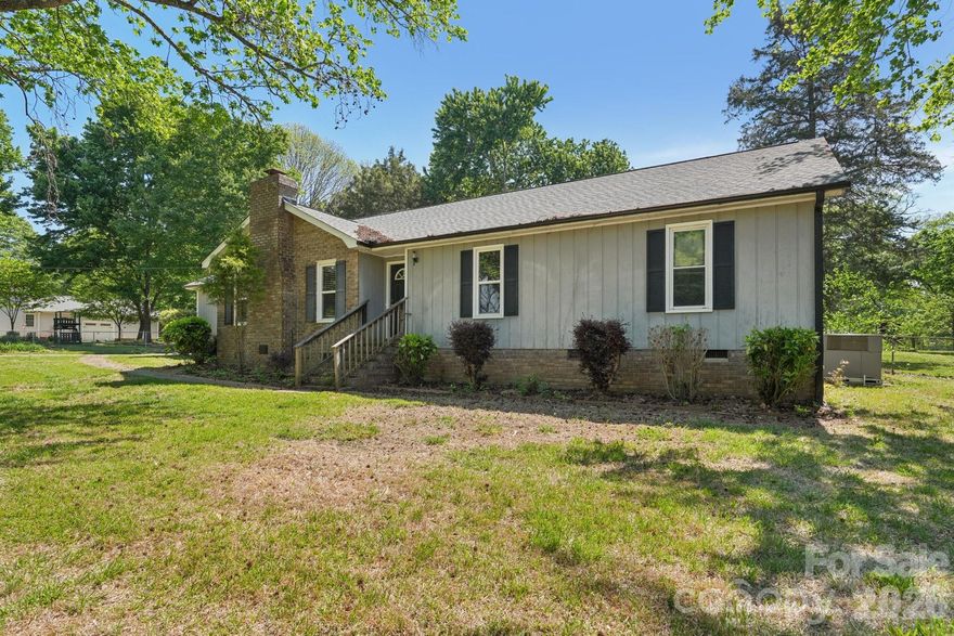 How about a home with no HOA and Rental Income potential?  You found it here at Robin Lane in Rock Hill.   4 bedroom 3 Bath home that has its own secnd living quarters for generational living, or even a possible tenant.  This home sits on over an acre of land and is ready to have the new owners personal updates added to it. Solar Panels help with the cost of electricity, detached garage is perfect for storage and a workshop.   Has a chicken coop for those who wish to start their own egg business.  So much room to do many activites on this 1 acre piece of land.