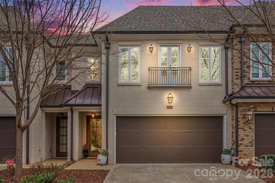 Luxurious 2018 Simonini city townhome in an unbeatable historic Elizabeth location! The main floor boasts a high-ceiling open floor plan, featuring a chef's kitchen with top of the line appliances, custom cabinetry, and generous island with seating for five; a stately dining area, and an inviting living room with gas log fireplace. A floor-to-ceiling wall of windows with sliding doors takes you out to a covered patio overlooking the private backyard, with an outdoor fireplace for cozy evenings. A butler's pantry and half bath complete the main level along with a spacious two-car garage. The upper level owner's suite features a gorgeous bathroom with dual vanity, soaking tub, towel warmer, and separate water closet; plus an impressive custom walk-in closet with a door through to the laundry room for ultimate convenience. Upstairs you'll also find a bonus loft space, plus two secondary bedrooms, both equipped with en-suite bathrooms and custom walk-in closets. Upgraded wood floors are featured throughout the home (no carpet!) and a generator has been added to power the home during any outages. Draper Place amenities include community clubhouse and dog park - and of course all of Charlotte at your fingertips. Schedule your private tour today!