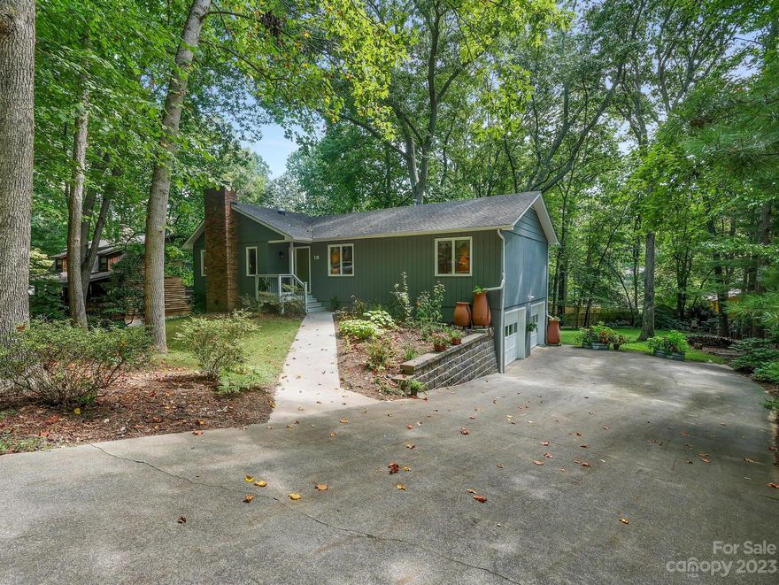 This charming, meticulously maintained, renovated, move in ready home is located on a cul-de-sac is minutes from Hendersonville, South Asheville shopping and restaurants, yet tucked away in the coveted private and well-established Royal Pines community. The rich and lovingly cared for backyard landscape with tress and open space creates a private sanctuary feel, where you can escape, entertain guests and pets can roam. This main floor features ¾” hardwood floors throughout, main bedroom w/bath, 2 more bedrooms and a hallway full bath. The tastefully renovated kitchen includes updated appliances, windows, Ice Stone counter tops and porcelain tile floors. The kitchen flows into the dining room, foyer, family room and open to the back deck. The hallway stairs with wool carpet lead to an open, fully finished basement, with a cozy woodfire stove, a full bathroom, access to back deck via French doors and the two-car garage. Decks are Trex decking attached to wood rails and metal spindles.